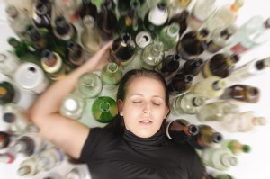 Yound beautiful woman in depression, drinking alcohol