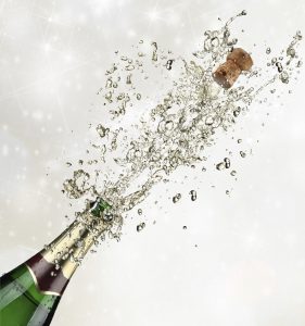 Close-up of champagne explosion. Celebration theme.