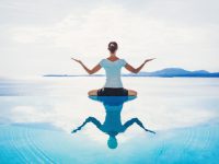 Young woman meditating outdoors
